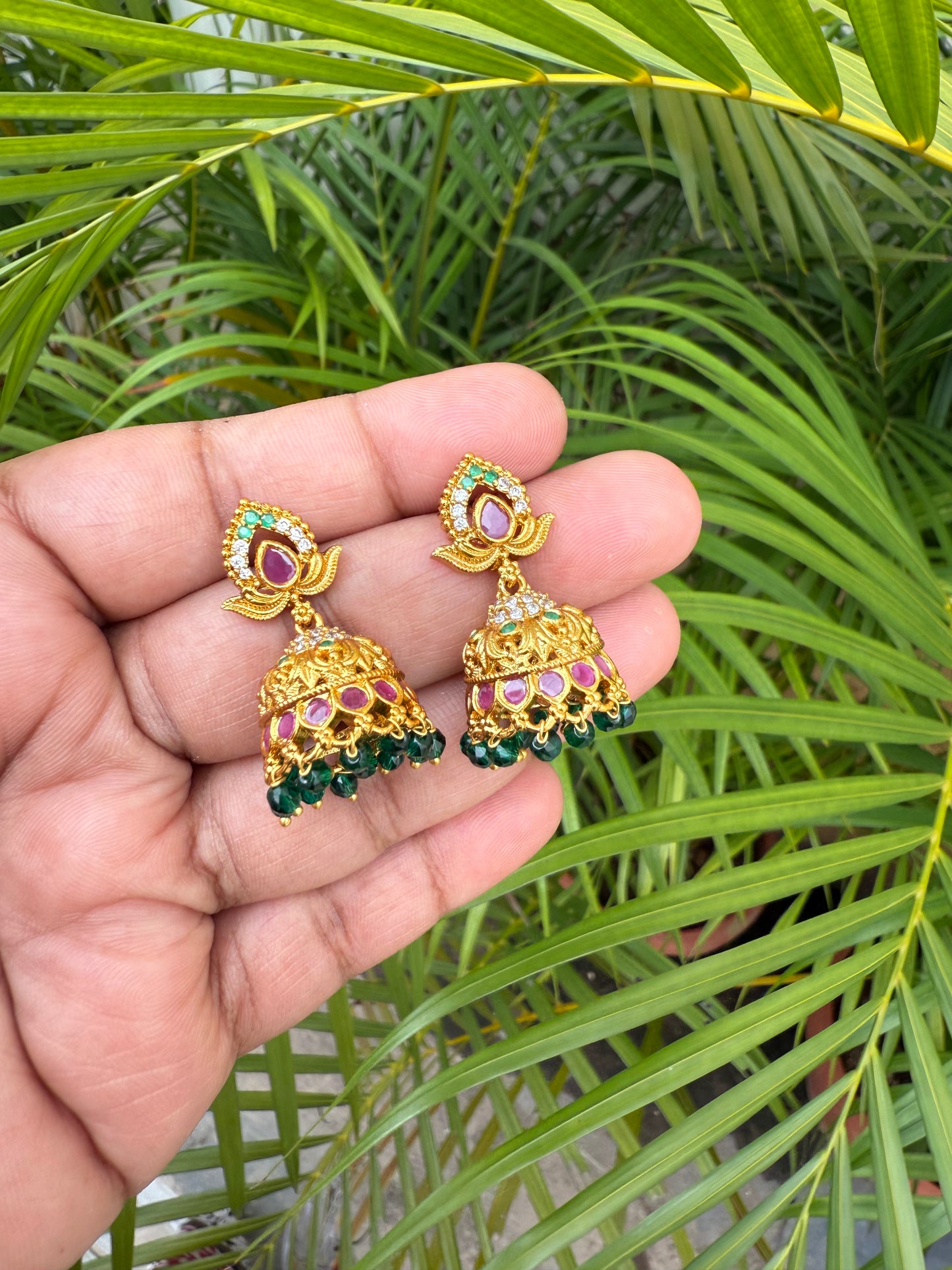 Leaf type stone jumka with green beads