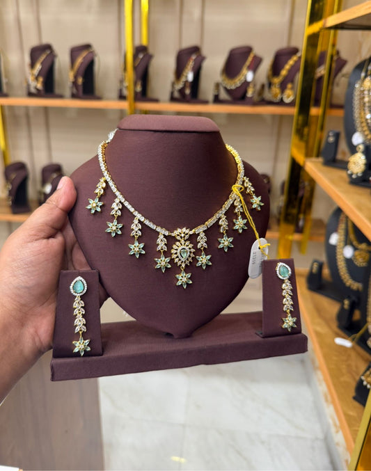 Pastel green star necklace