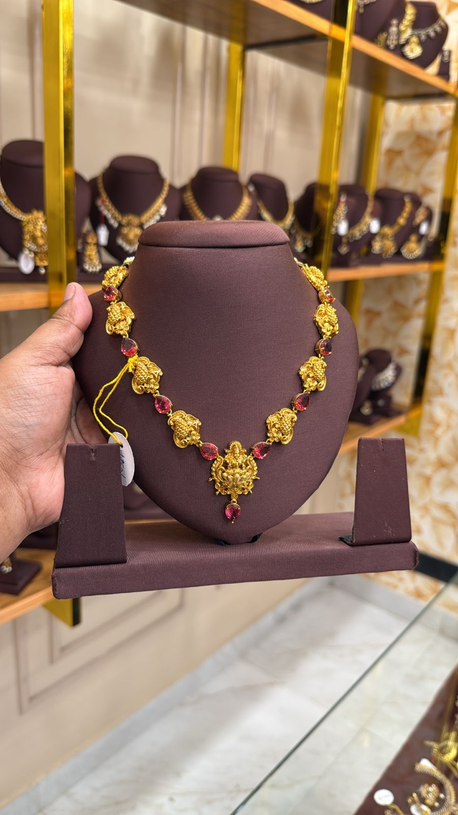 Lakshmi with ruby stone necklace